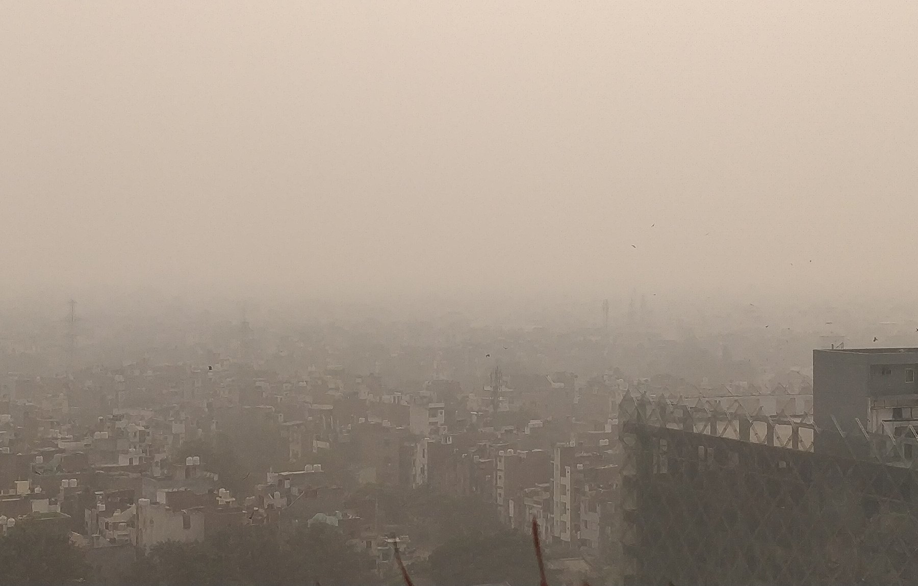 New Delhi, its streets and skyline softened by suspended particulate
